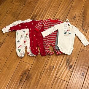 4 BNWT newborn Christmas outfits. 3 zip footies, one is onesie/pants. Carter’s.